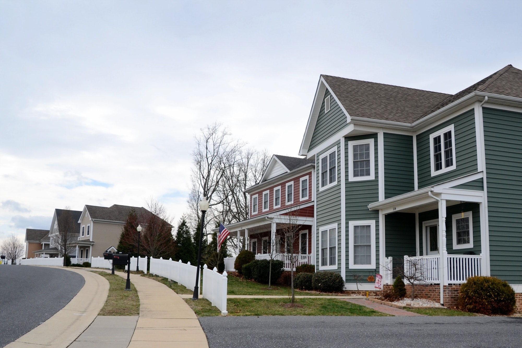A street of modern homes houses in various colors to make a cozy neighborhood of prime real estate