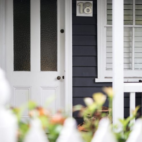 front-of-cute-timber-home-cottage-in-local-street-2023-11-27-05-08-04-utc